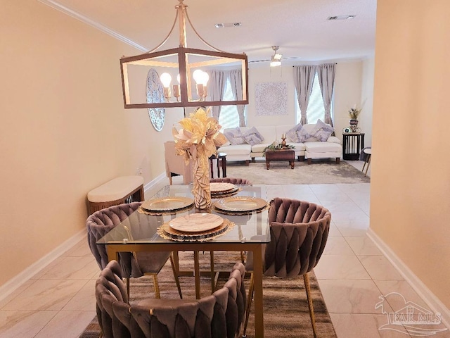 dining room with crown molding, tile patterned floors, visible vents, and baseboards