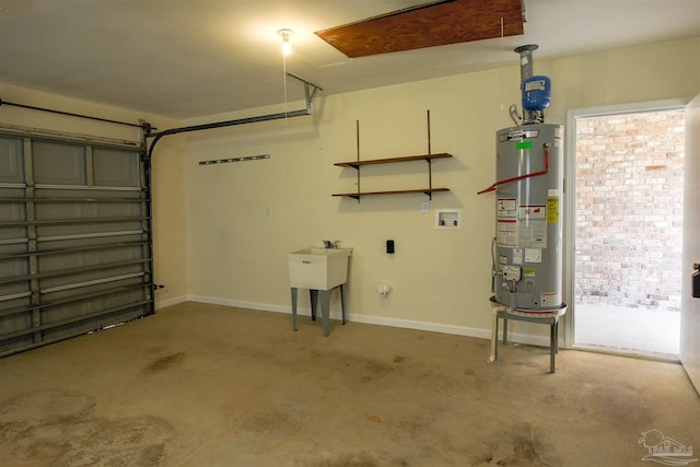 garage featuring water heater and baseboards