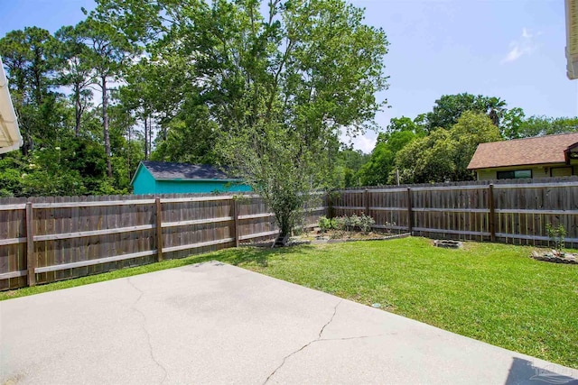 view of yard with a fenced backyard and a patio