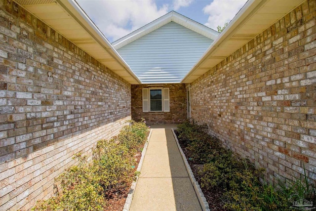 view of home's exterior with brick siding