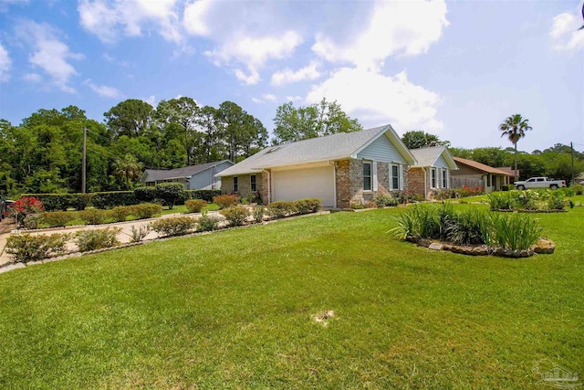 view of front of home with a garage, a front lawn, and brick siding