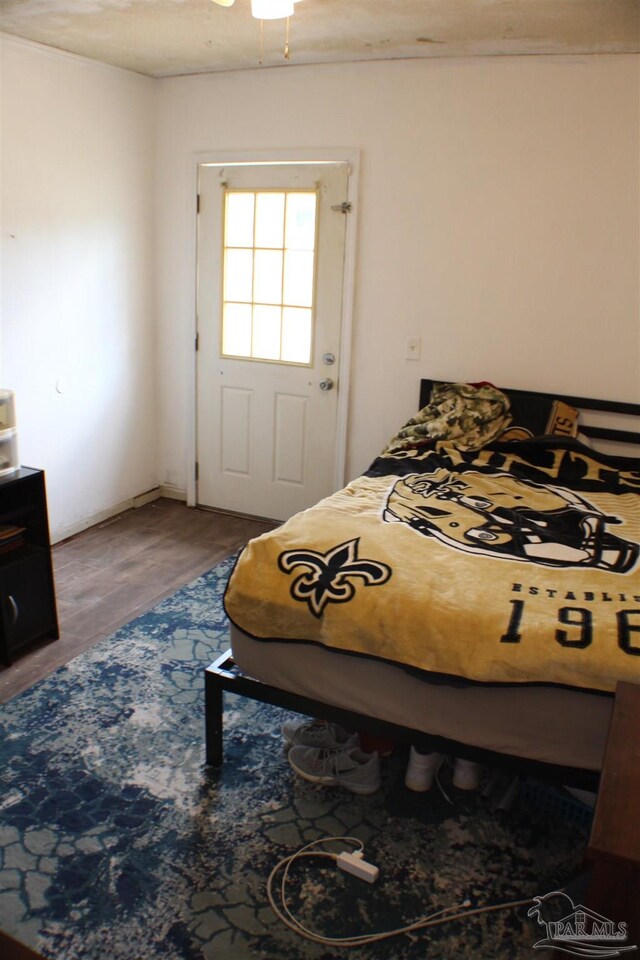 bedroom with hardwood / wood-style floors