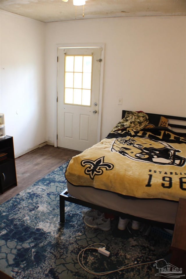 bedroom with wood finished floors