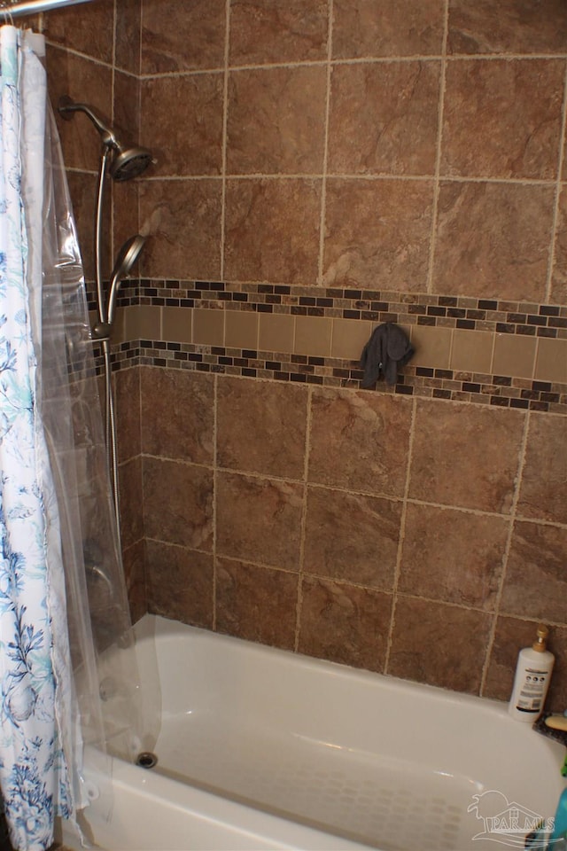 full bathroom featuring shower / bath combination with curtain