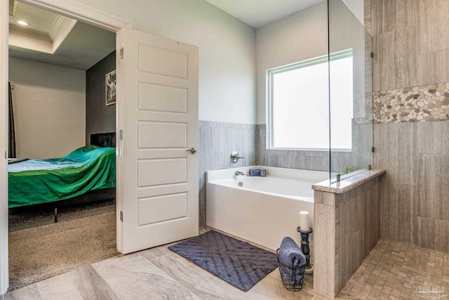 bathroom featuring tile patterned flooring, independent shower and bath, and ornamental molding