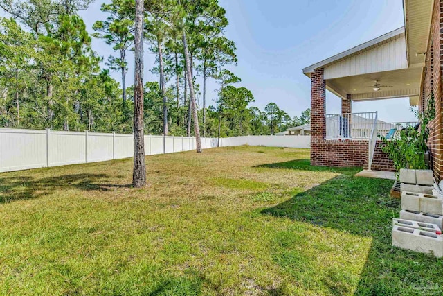 view of yard featuring ceiling fan