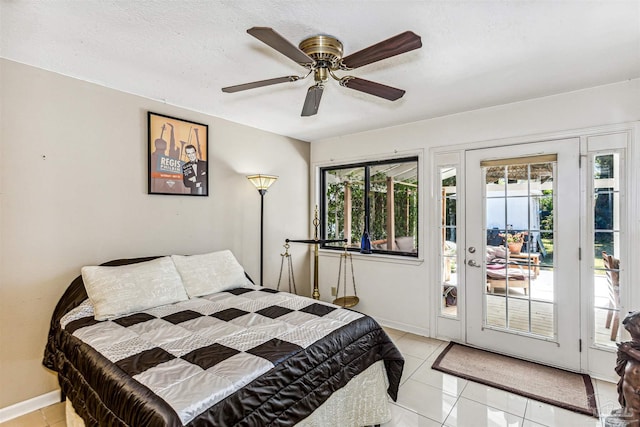 bedroom with light tile patterned flooring, ceiling fan, access to exterior, and a textured ceiling