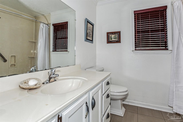 bathroom featuring tile patterned flooring, ornamental molding, vanity, and toilet