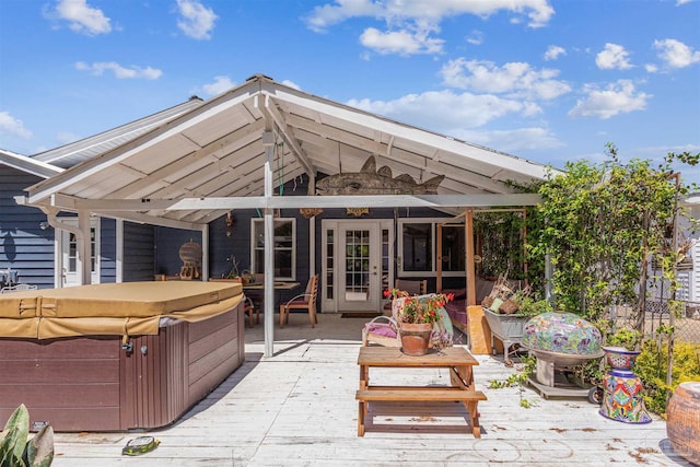 exterior space with a wooden deck and a hot tub