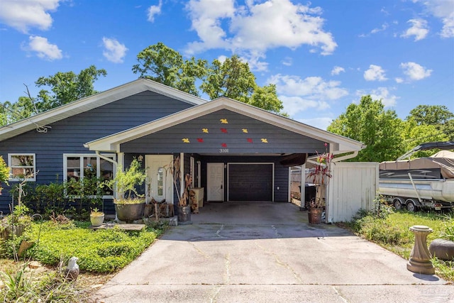 view of front of house with a garage and a carport