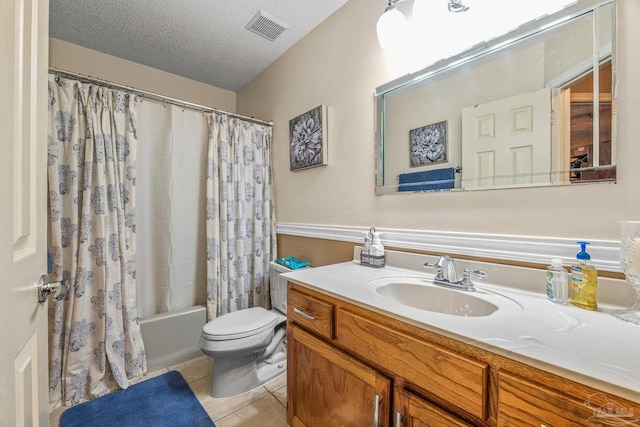 full bathroom with shower / bathtub combination with curtain, toilet, vanity, tile patterned floors, and a textured ceiling