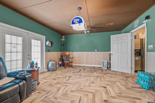 misc room with vaulted ceiling, light parquet flooring, ceiling fan, and french doors