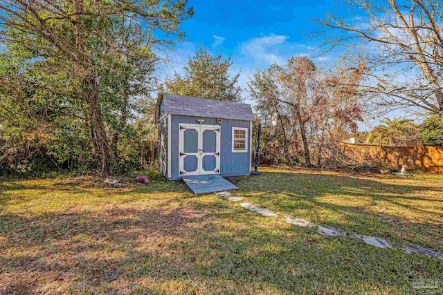 view of outbuilding with a lawn