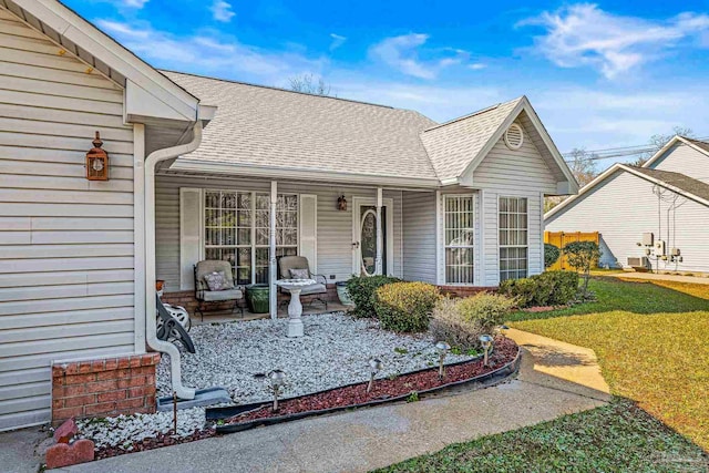 exterior space with a porch and a lawn