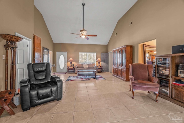 living room with high vaulted ceiling, ceiling fan, and light tile patterned floors