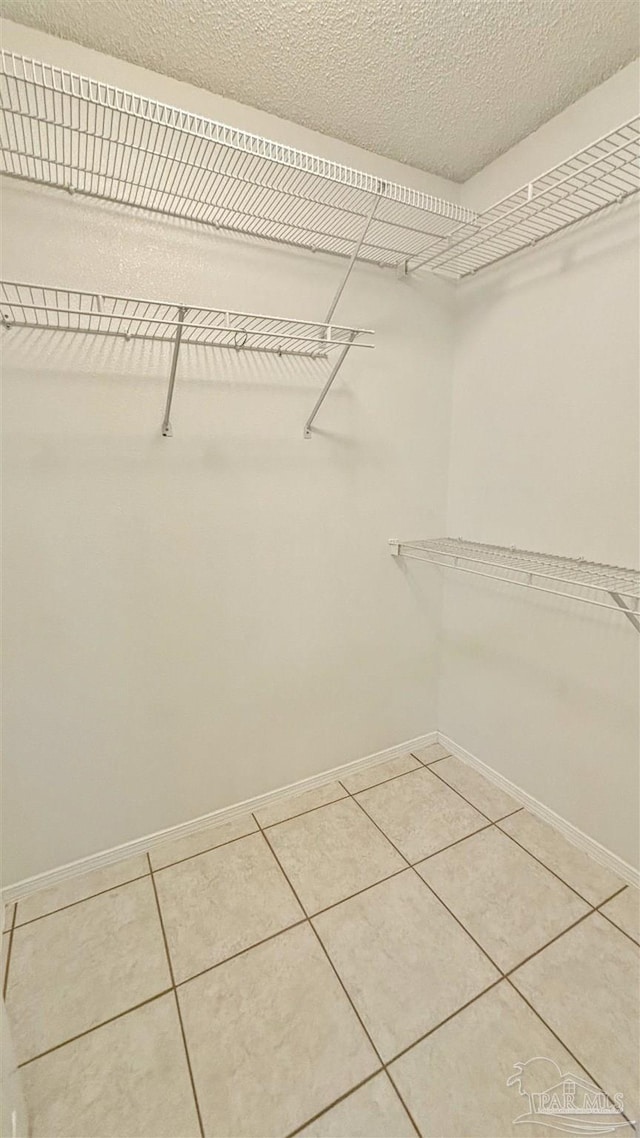 walk in closet featuring tile patterned floors