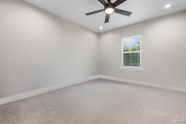 empty room featuring carpet flooring and ceiling fan