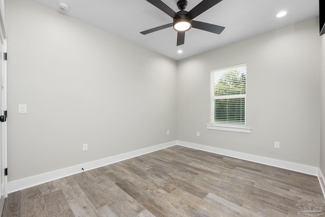 empty room featuring ceiling fan and hardwood / wood-style floors