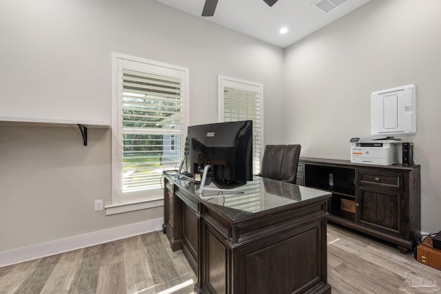 office area with light hardwood / wood-style floors and ceiling fan