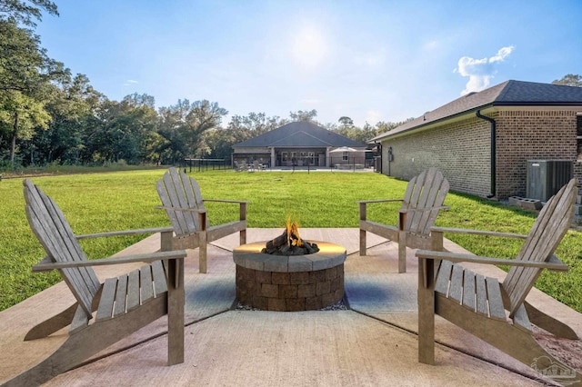 view of patio with central air condition unit, a gazebo, and an outdoor fire pit