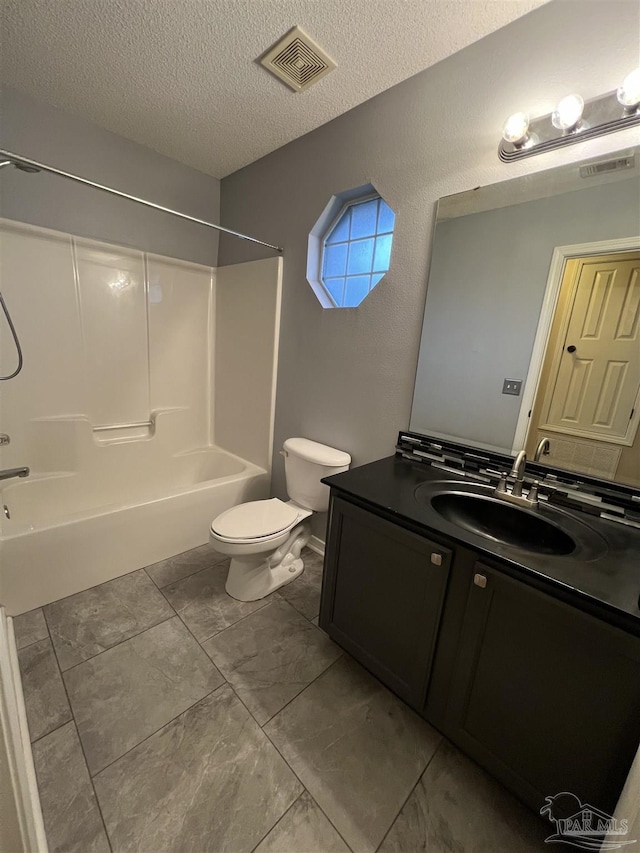 full bathroom featuring toilet, a textured ceiling, shower / bathtub combination, and vanity