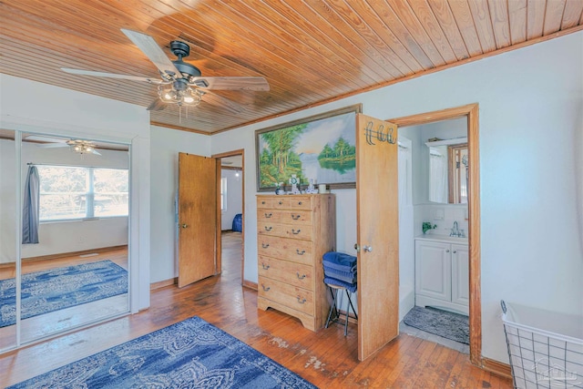 1424 Chemstrand Rd, Cantonment, FL 32533 - bedroom with wooden ceiling, a sink, hardwood / wood-style flooring, a ceiling fan, and crown molding