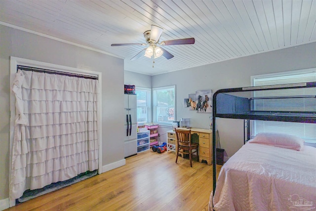 1424 Chemstrand Rd, Cantonment, FL 32533 - bedroom featuring wood finished floors, freestanding refrigerator, ceiling fan, and baseboards
