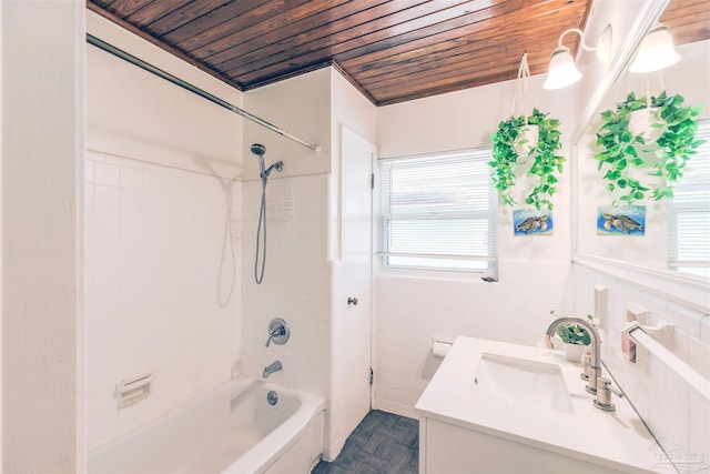 1424 Chemstrand Rd, Cantonment, FL 32533 - bathroom featuring wood ceiling, vanity, tile walls,  shower combination, and wainscoting