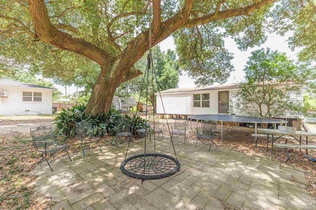 1424 Chemstrand Rd, Cantonment, FL 32533 - view of patio with fence and a trampoline