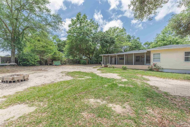 1424 Chemstrand Rd, Cantonment, FL 32533 - view of green lawn with a sunroom
