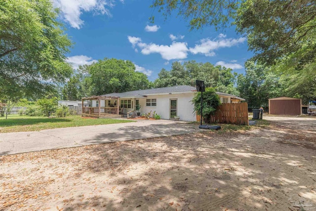 1424 Chemstrand Rd, Cantonment, FL 32533 - view of front facade with fence and stucco siding