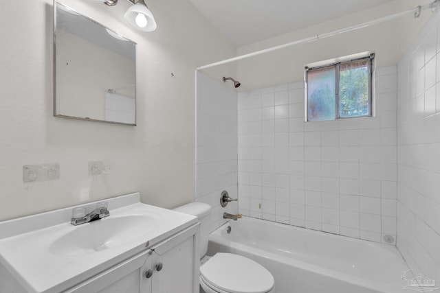 full bathroom featuring vanity, toilet, and tiled shower / bath combo