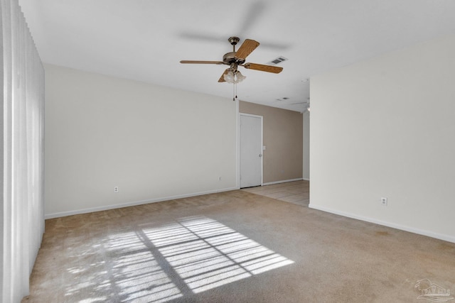 carpeted empty room with ceiling fan