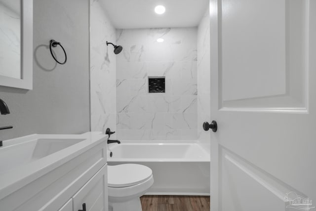 5686 Avondale Rd, Pensacola, FL 32526 - bathroom with tub / shower combination, toilet, vanity, and wood finished floors
