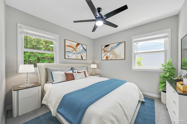 5686 Avondale Rd, Pensacola, FL 32526 - carpeted bedroom featuring multiple windows, baseboards, and ceiling fan