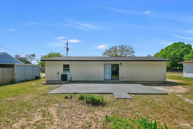 5686 Avondale Rd, Pensacola, FL 32526 - back of house featuring a yard, central AC unit, and a patio area