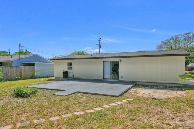 5686 Avondale Rd, Pensacola, FL 32526 - rear view of house with a patio area, a lawn, cooling unit, and fence