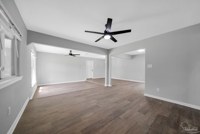 5686 Avondale Rd, Pensacola, FL 32526 - unfurnished living room featuring baseboards, dark wood-type flooring, and a ceiling fan