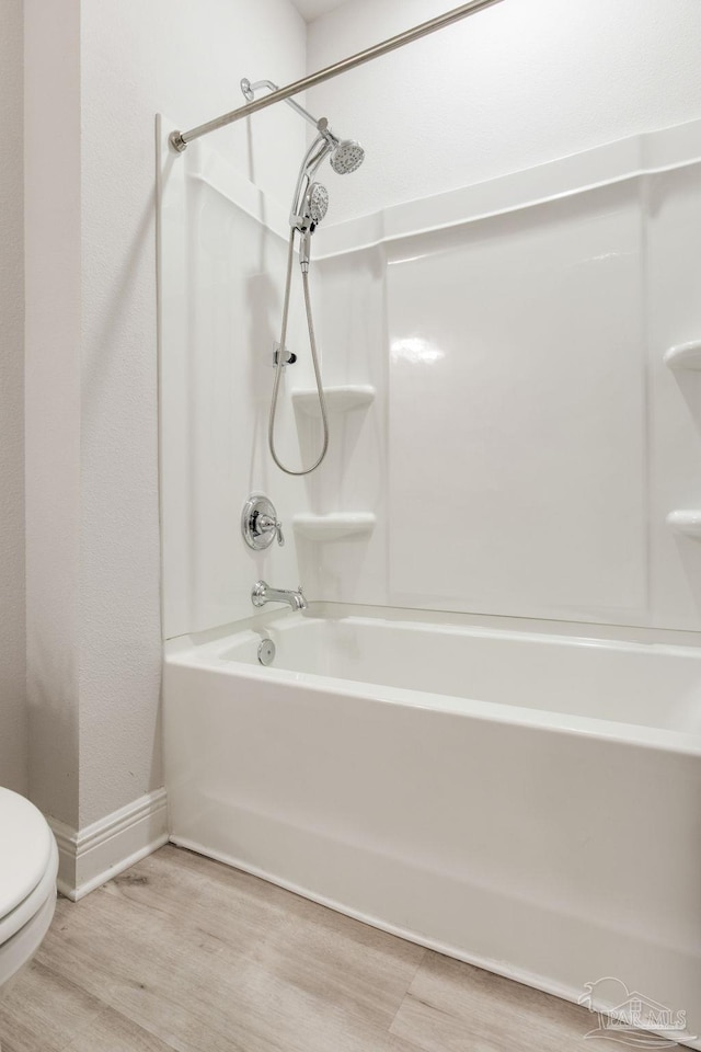 7822 Burnside Loop, Pensacola, FL 32526 - bathroom with shower / bath combination and wood finished floors