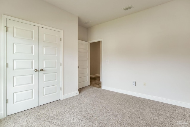 7822 Burnside Loop, Pensacola, FL 32526 - unfurnished bedroom featuring carpet flooring and a closet