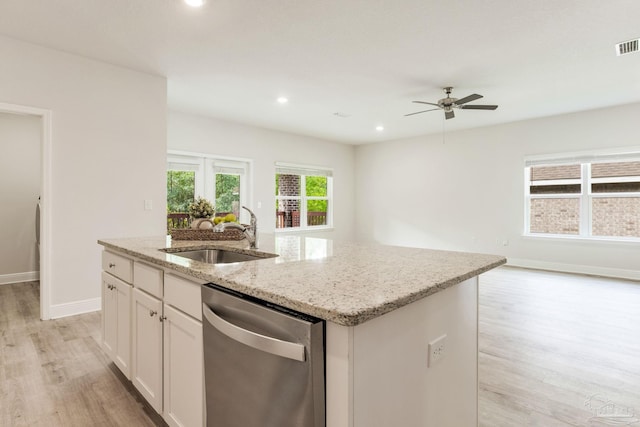 7822 Burnside Loop, Pensacola, FL 32526 - kitchen featuring dishwasher, an island with sink, light wood-style flooring, ceiling fan, and open floor plan