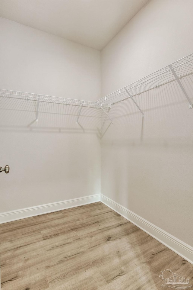 7822 Burnside Loop, Pensacola, FL 32526 - spacious closet with light wood-type flooring