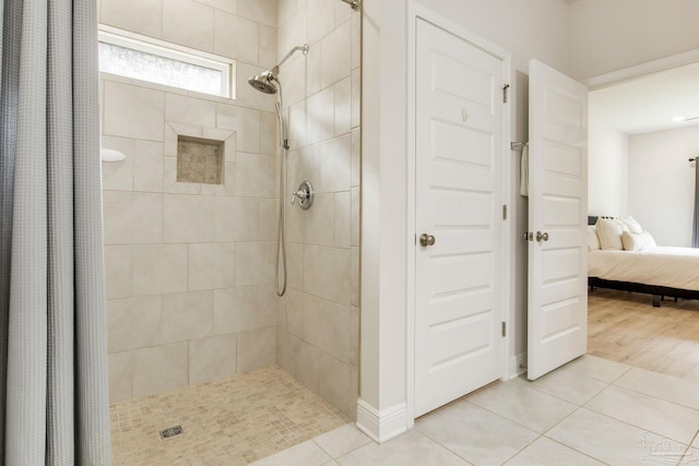 7822 Burnside Loop, Pensacola, FL 32526 - ensuite bathroom with tiled shower and tile patterned flooring