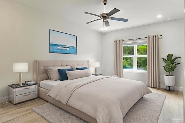 7822 Burnside Loop, Pensacola, FL 32526 - bedroom with light wood finished floors and a ceiling fan