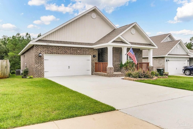 7822 Burnside Loop, Pensacola, FL 32526 - craftsman house featuring brick siding, an attached garage, board and batten siding, and a front yard