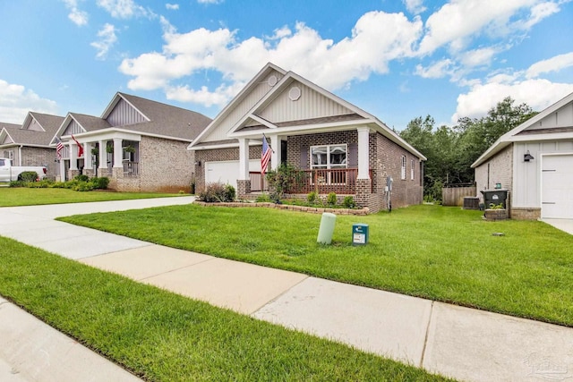7822 Burnside Loop, Pensacola, FL 32526 - craftsman house featuring brick siding, board and batten siding, a porch, a front lawn, and an attached garage