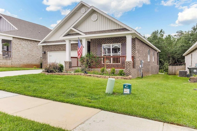 7822 Burnside Loop, Pensacola, FL 32526 - craftsman house with brick siding, board and batten siding, a front yard, concrete driveway, and a garage