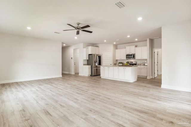 7822 Burnside Loop, Pensacola, FL 32526 - unfurnished living room featuring a ceiling fan, recessed lighting, and light wood finished floors