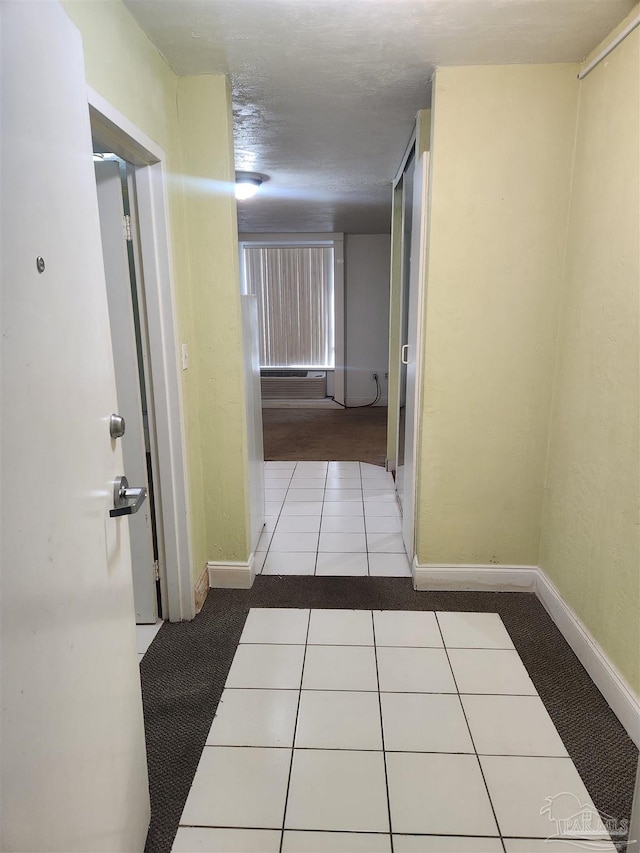 corridor featuring light tile patterned floors