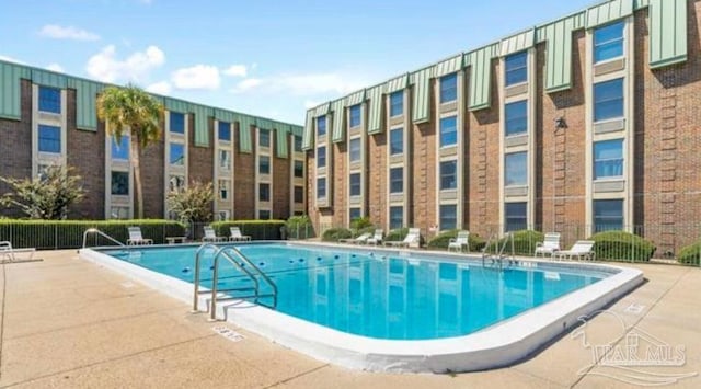 view of swimming pool featuring a patio